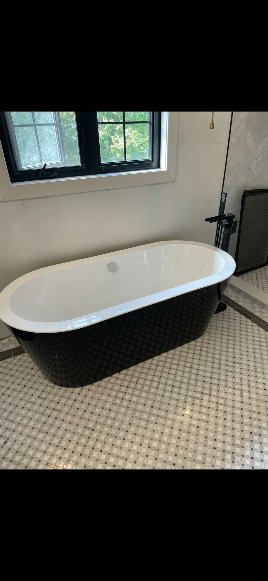 Freestanding soaker tub installed by HSC Plumbing in a luxury bathroom renovation